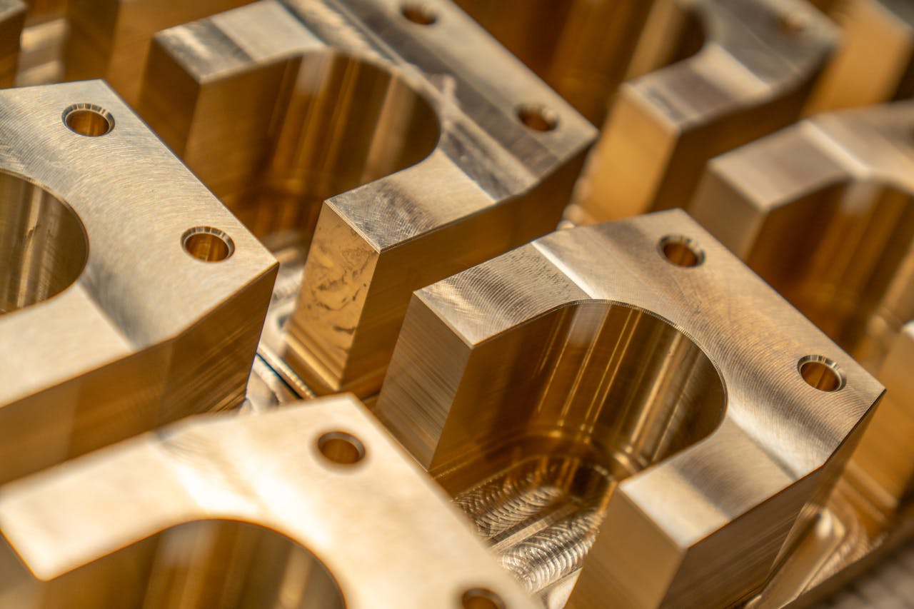 Detailed close-up of machined metal components in an industrial setting.
